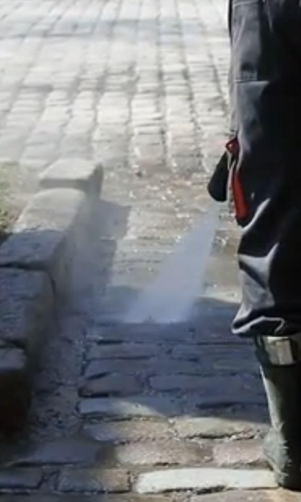 Pressure washing a driveway